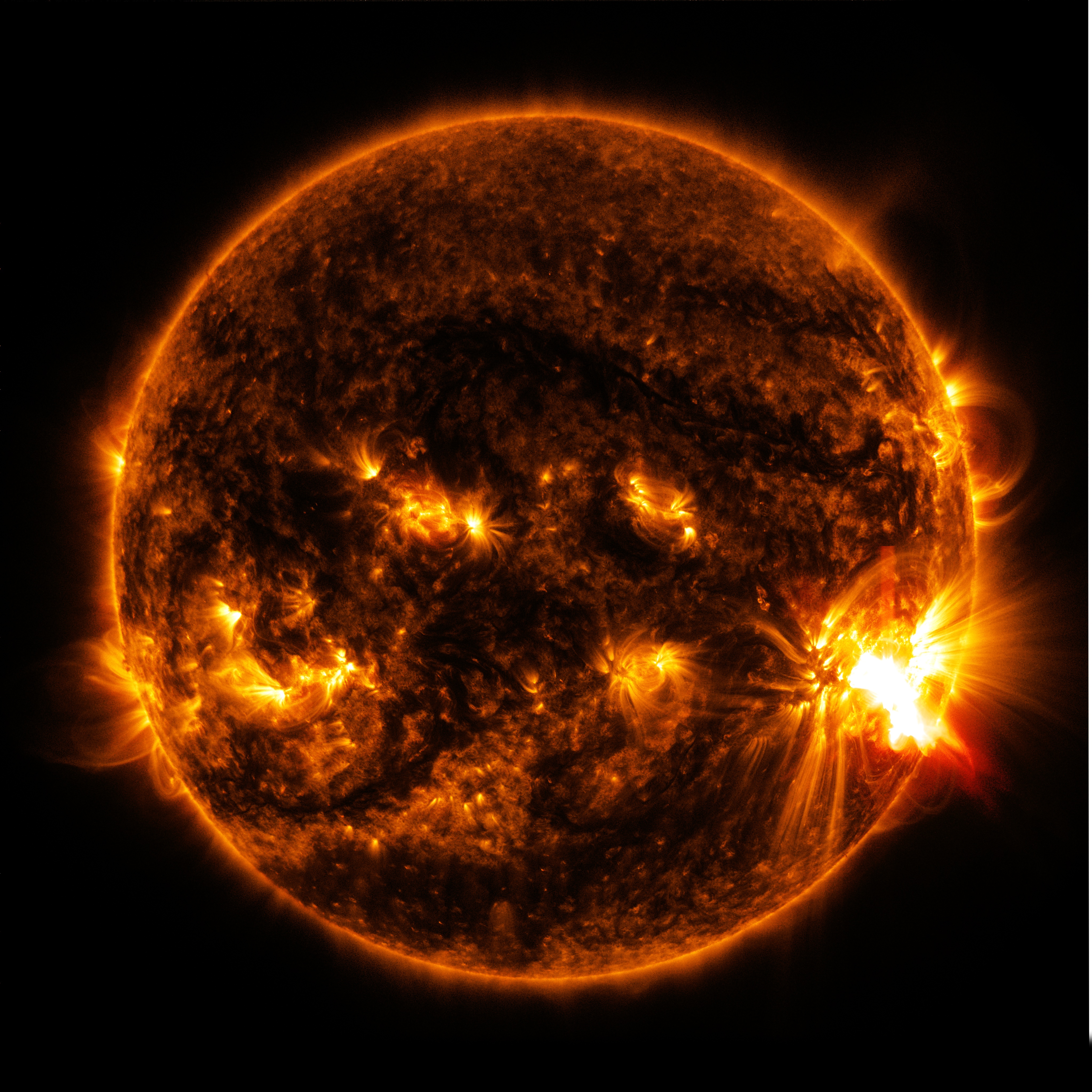 NASA's Solar Dynamics Observatory captured this image of an X2.0-class solar flare bursting off the lower right side of the sun on Oct. 27, 2014.  (Image Credit NASA / SDO)