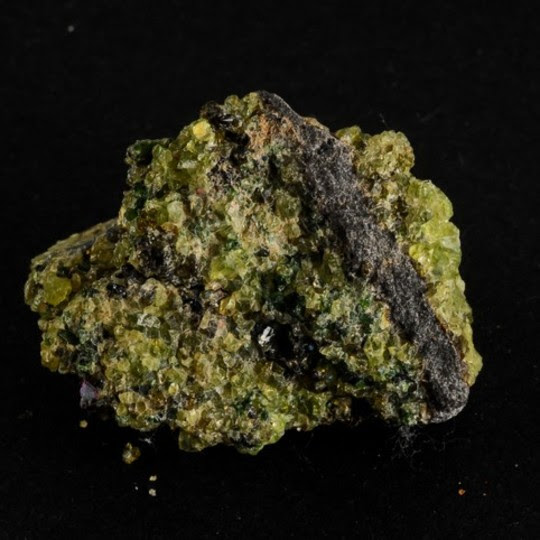 Photo of the mineral olivine.  Credit: Kent Pørksen